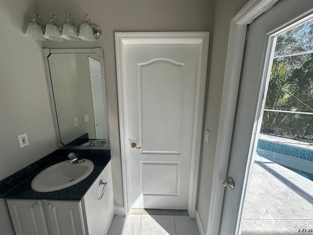 bathroom with tile patterned flooring and vanity