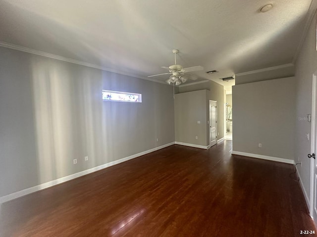 empty room featuring ceiling fan, dark hardwood / wood-style floors, and ornamental molding