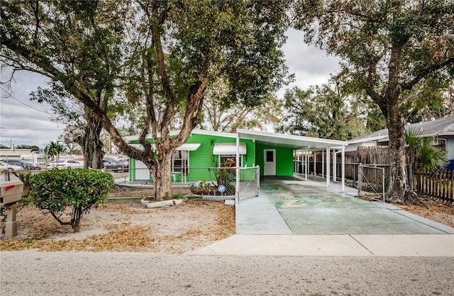 ranch-style house featuring a carport