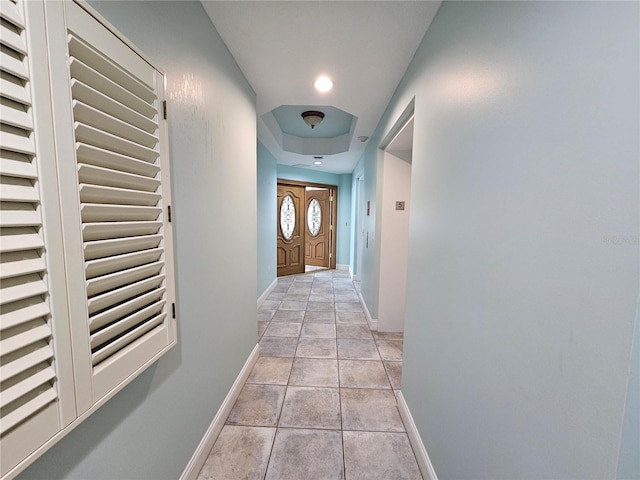 hallway with light tile patterned floors