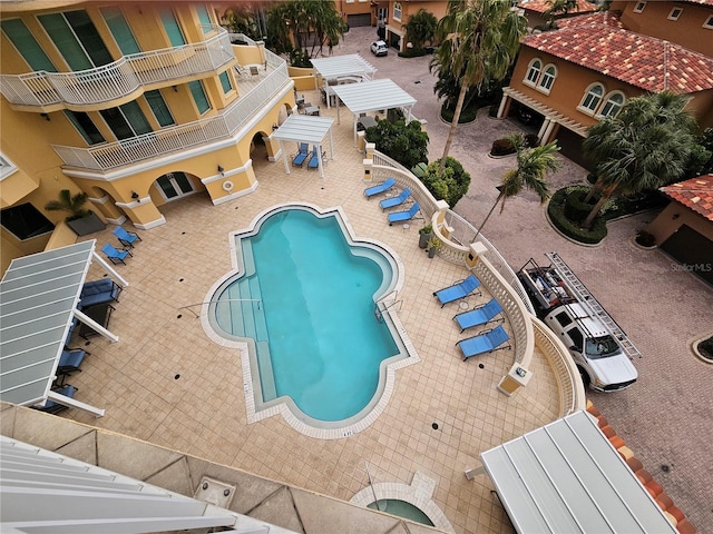 view of swimming pool with a patio