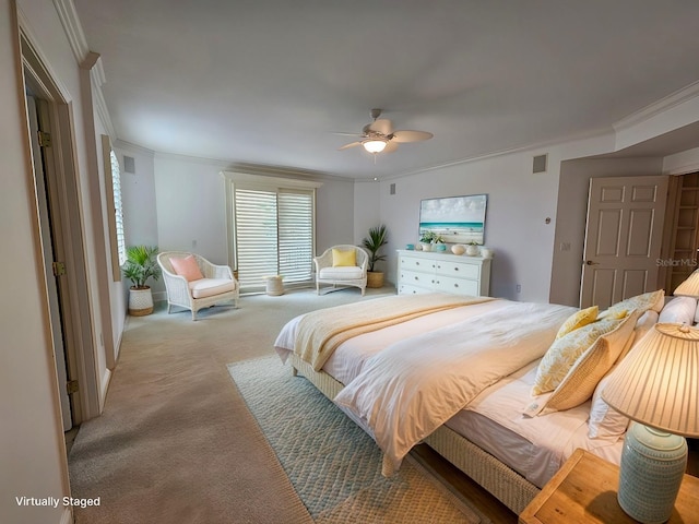 carpeted bedroom with ceiling fan and crown molding