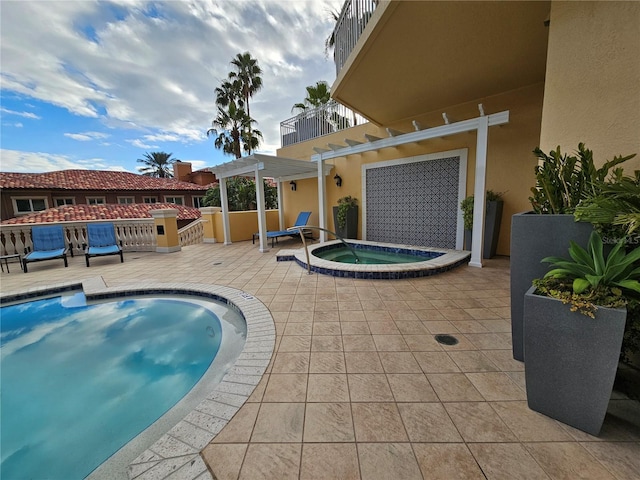 view of swimming pool featuring an in ground hot tub, a patio area, and a pergola