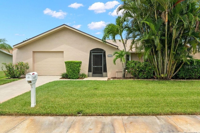 single story home with a garage and a front lawn