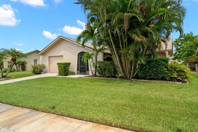 view of front facade featuring a garage and a front lawn