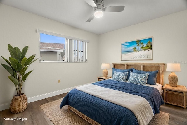 bedroom with ceiling fan and dark hardwood / wood-style floors