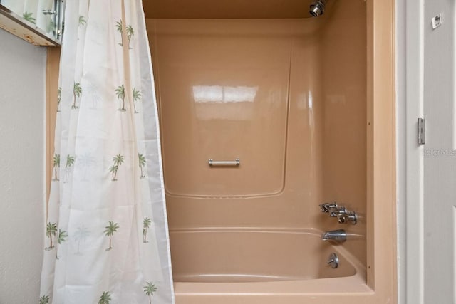 bathroom featuring shower / tub combo with curtain