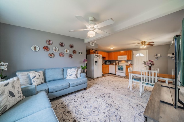 living room featuring ceiling fan