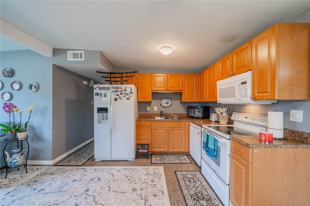 kitchen featuring sink and white appliances