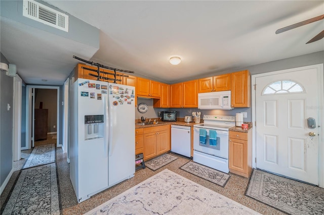 kitchen with ceiling fan, sink, and white appliances