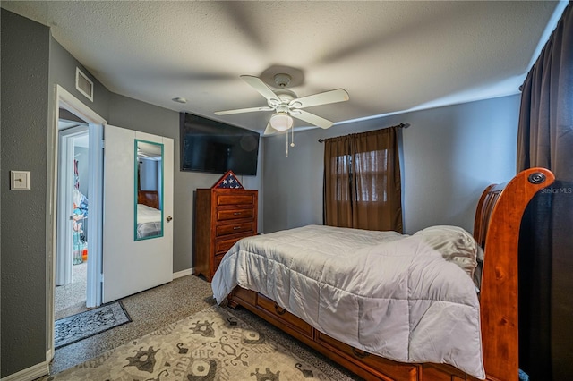 bedroom featuring a textured ceiling and ceiling fan