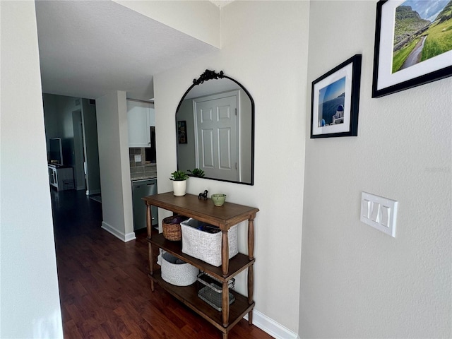 hallway with dark wood-type flooring