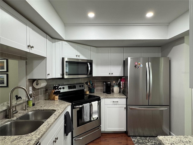 kitchen with sink, white cabinetry, and appliances with stainless steel finishes