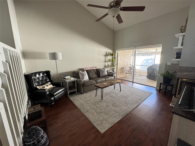 living room featuring high vaulted ceiling, ceiling fan, and dark hardwood / wood-style floors