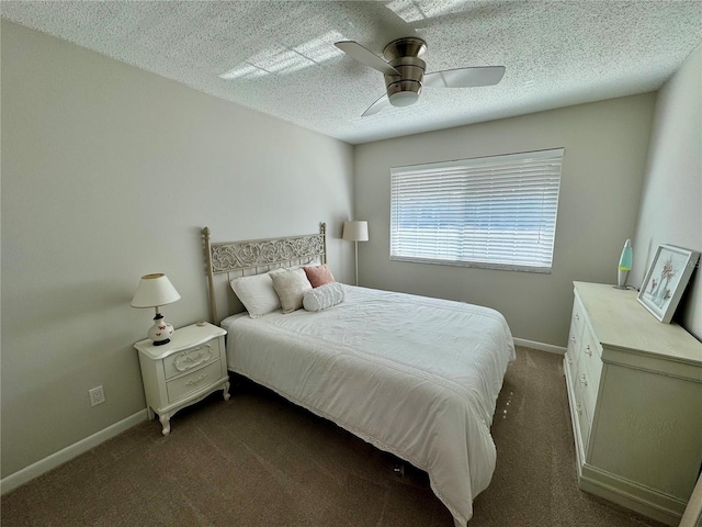 bedroom featuring ceiling fan, a textured ceiling, and dark colored carpet