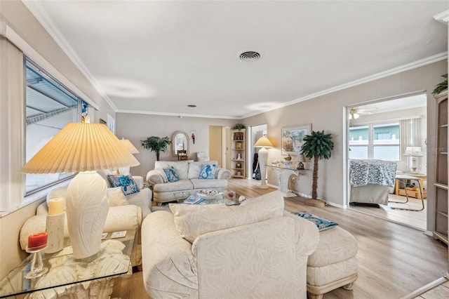 living room featuring crown molding and hardwood / wood-style floors