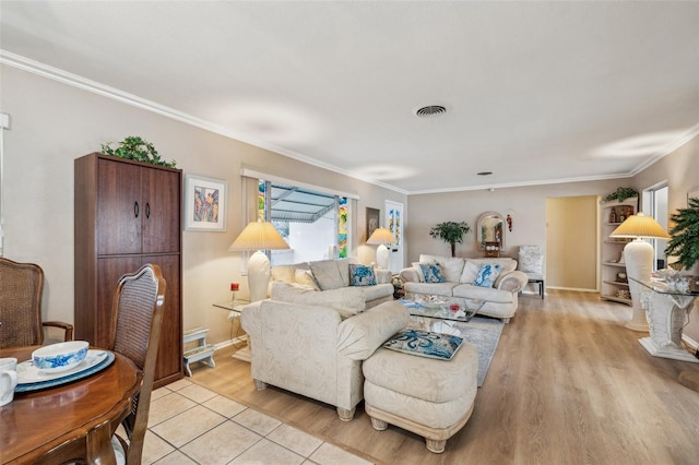 living room featuring ornamental molding and light hardwood / wood-style flooring