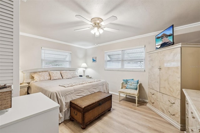 bedroom with multiple windows, ceiling fan, ornamental molding, and light hardwood / wood-style flooring