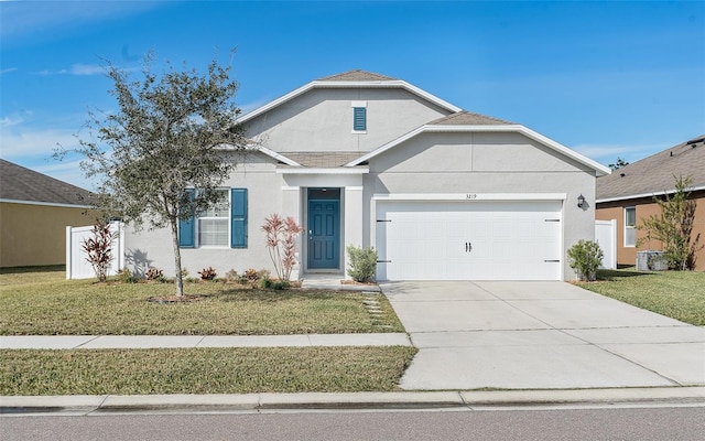 view of front facade featuring a front lawn and a garage