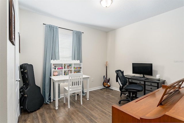 home office with dark wood-type flooring