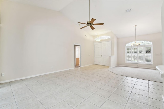 unfurnished living room featuring light tile patterned flooring, ceiling fan with notable chandelier, and high vaulted ceiling