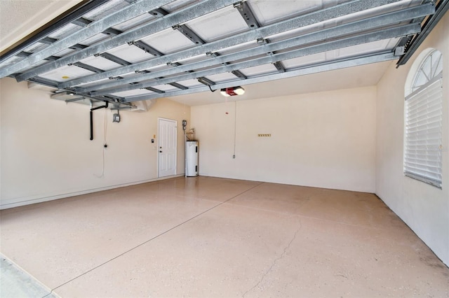 garage featuring electric water heater and a garage door opener