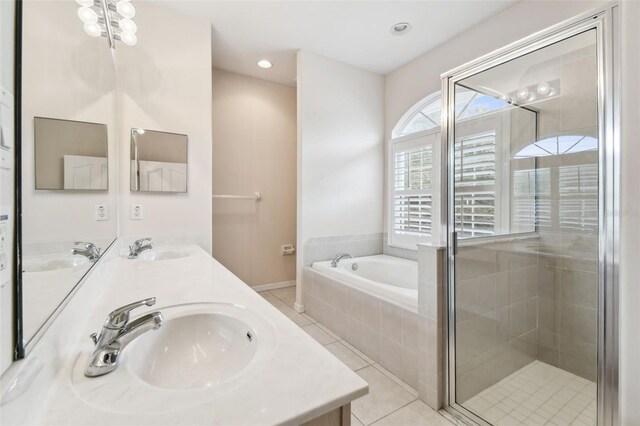 bathroom featuring tile patterned floors, vanity, and independent shower and bath