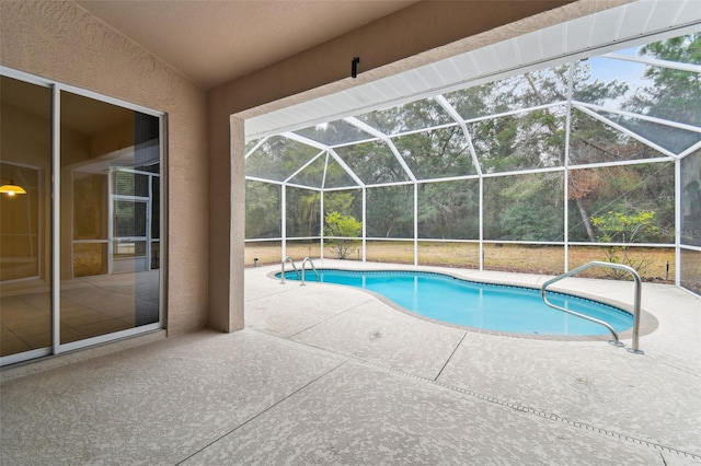 view of pool featuring a lanai and a patio area