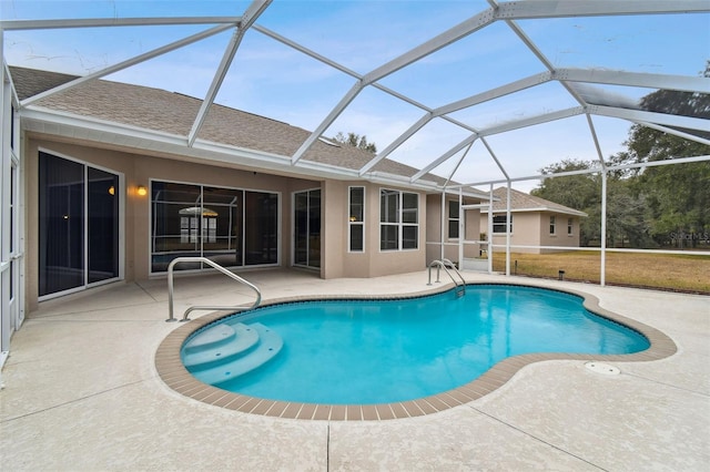 view of swimming pool featuring a lanai and a patio area