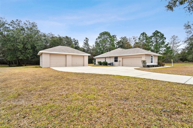 ranch-style home with a garage and a front yard