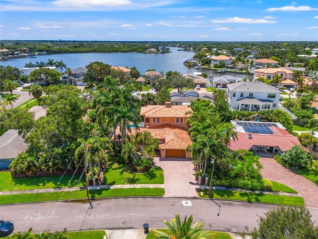 birds eye view of property featuring a water view and a residential view