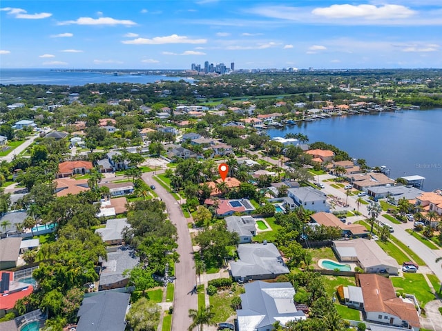 drone / aerial view with a water view and a residential view