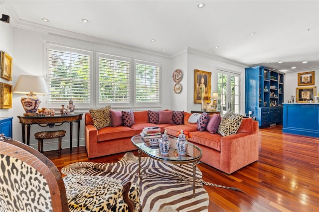 living room with ornamental molding, recessed lighting, and wood finished floors