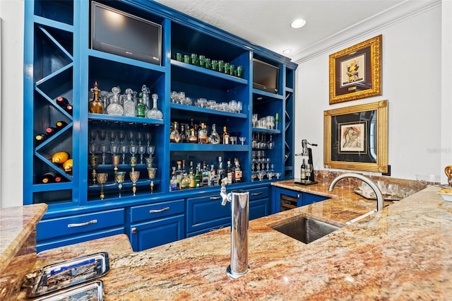 bar featuring wet bar, ornamental molding, a sink, and recessed lighting