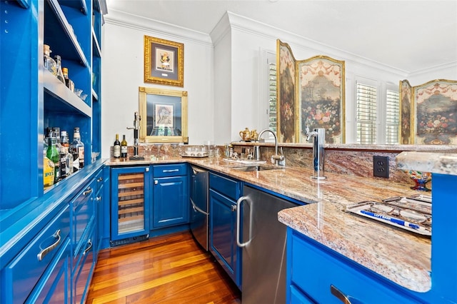 bar with beverage cooler, a sink, ornamental molding, wet bar, and dishwasher