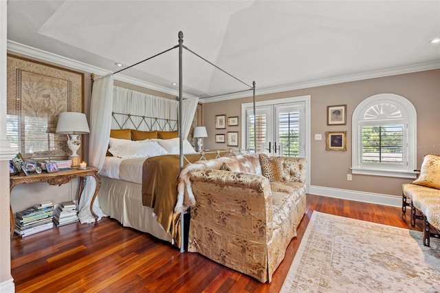 bedroom featuring dark wood-style floors, multiple windows, and ornamental molding