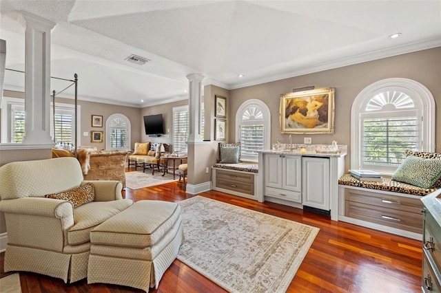 sitting room featuring decorative columns, visible vents, dark wood finished floors, ornamental molding, and recessed lighting