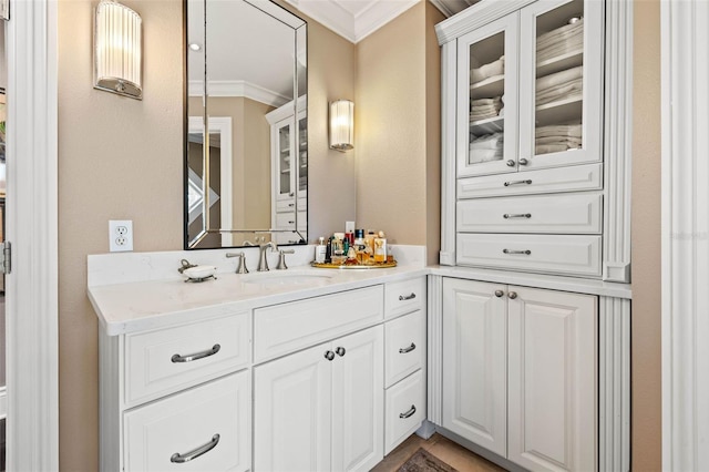 bathroom with vanity and crown molding