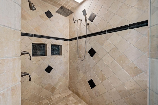 bathroom with a tile shower