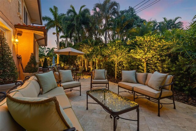 patio terrace at dusk with an outdoor living space