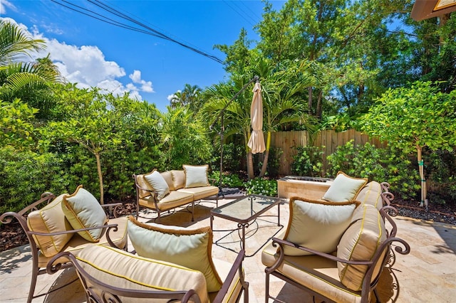 view of patio / terrace featuring fence and an outdoor hangout area