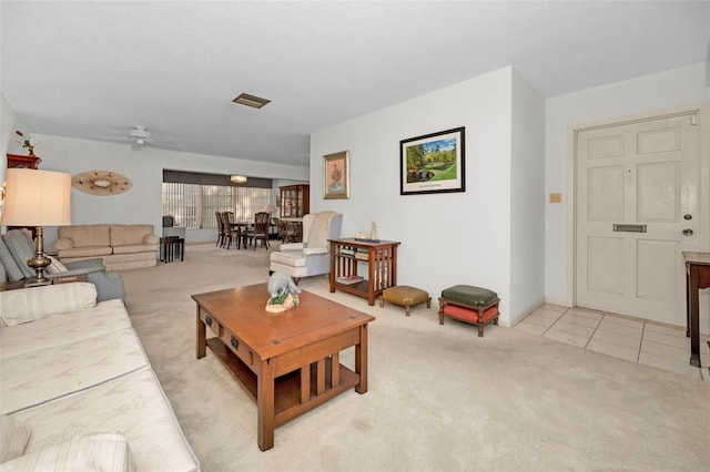 living room with ceiling fan and light carpet