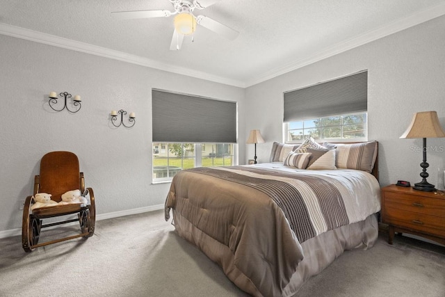 bedroom with ceiling fan, multiple windows, ornamental molding, and carpet floors