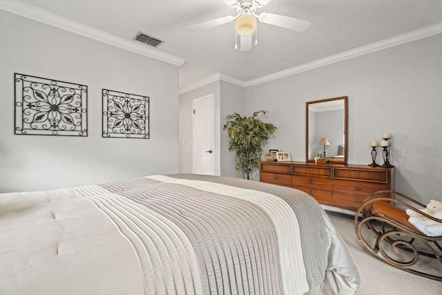 carpeted bedroom with ceiling fan, ornamental molding, and a textured ceiling