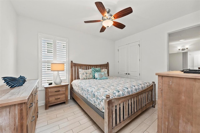 bedroom featuring ceiling fan and a closet