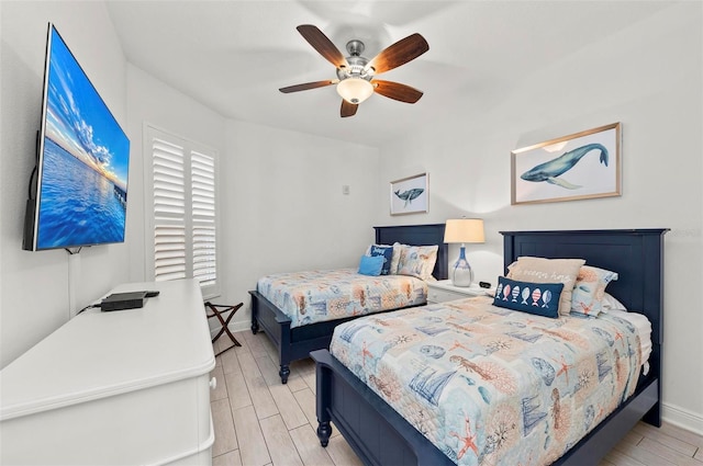 bedroom featuring ceiling fan and light wood-type flooring