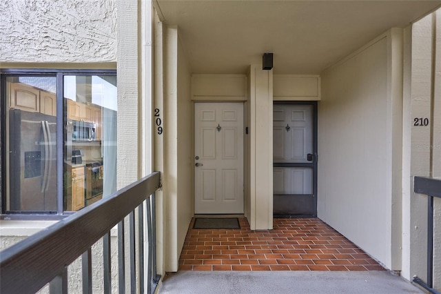 property entrance with a balcony