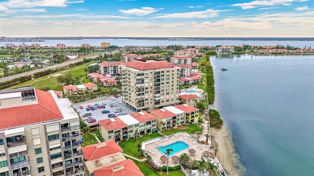 birds eye view of property with a water view