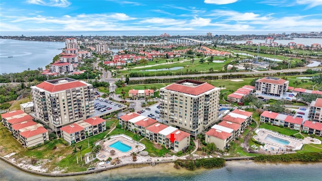 birds eye view of property with a water view