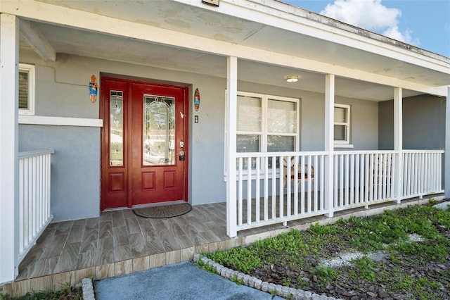 doorway to property with covered porch